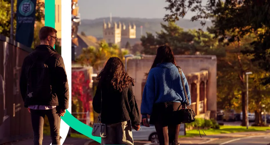 Students walking down the hill with the Exeter Catherdral in the distance.